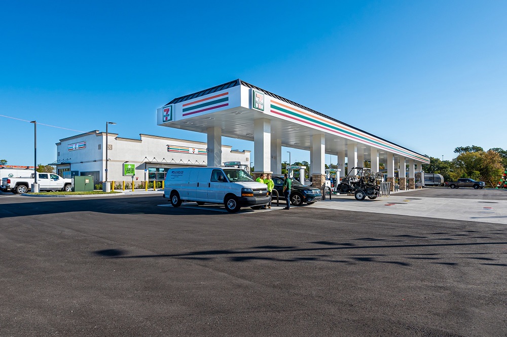 Exterior view of gas station with vehicles filling up their tanks